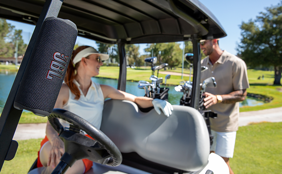 JBL Flip 7 with magnetic mount in use on a golf cart