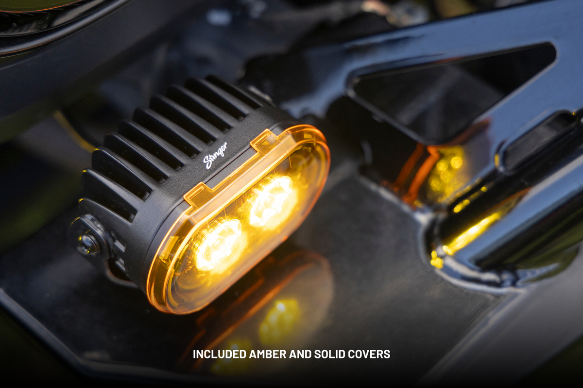 Stinger LED light pod with amber cover mounted on vehicle