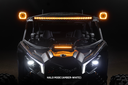Off-road vehicle with illuminated lights on a dark background