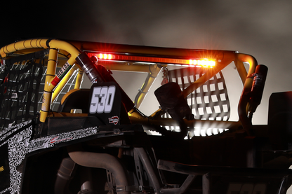 Stinger LED light bar mounted on yellow roll cage of off road vehicle